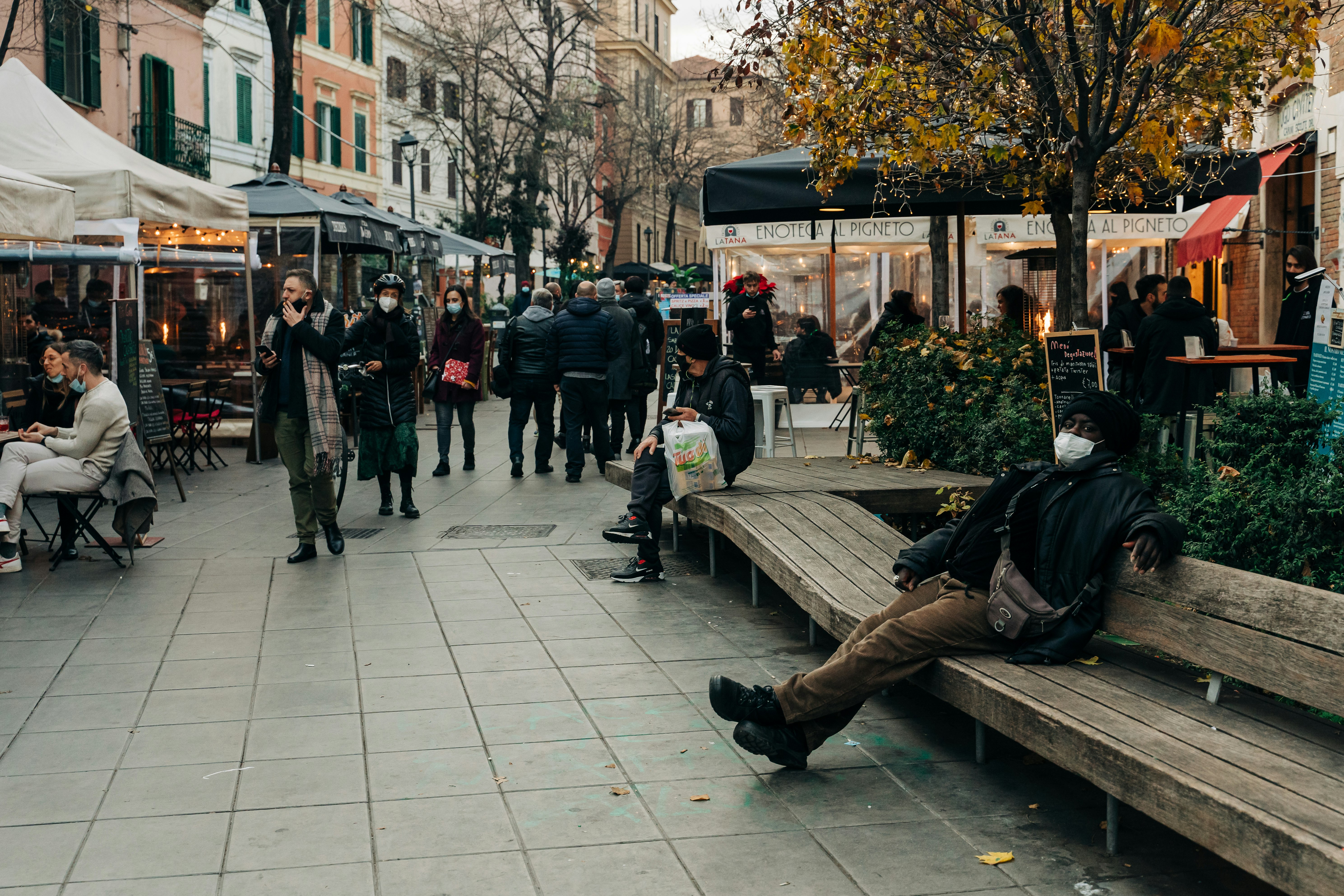 people walking on sidewalk during daytime